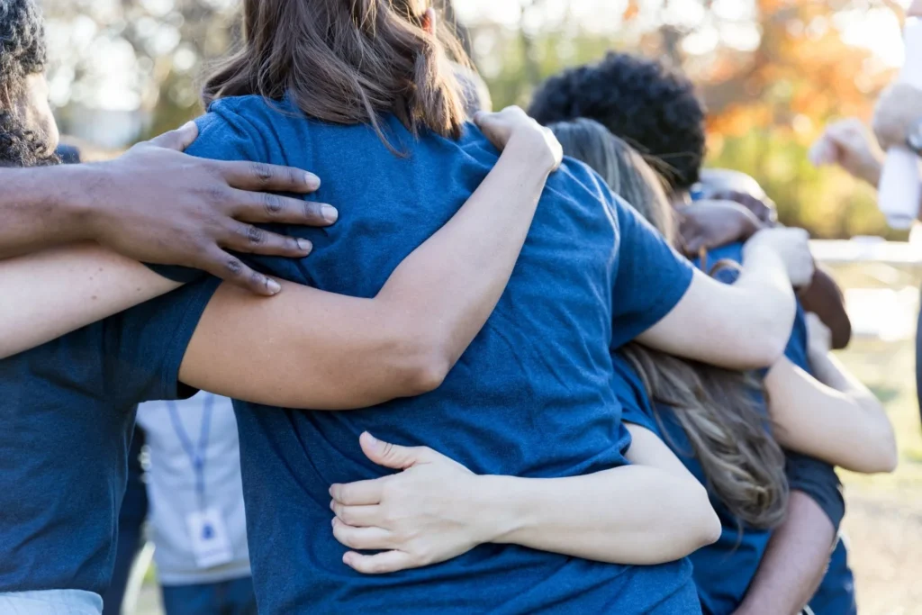 volunteers hugging