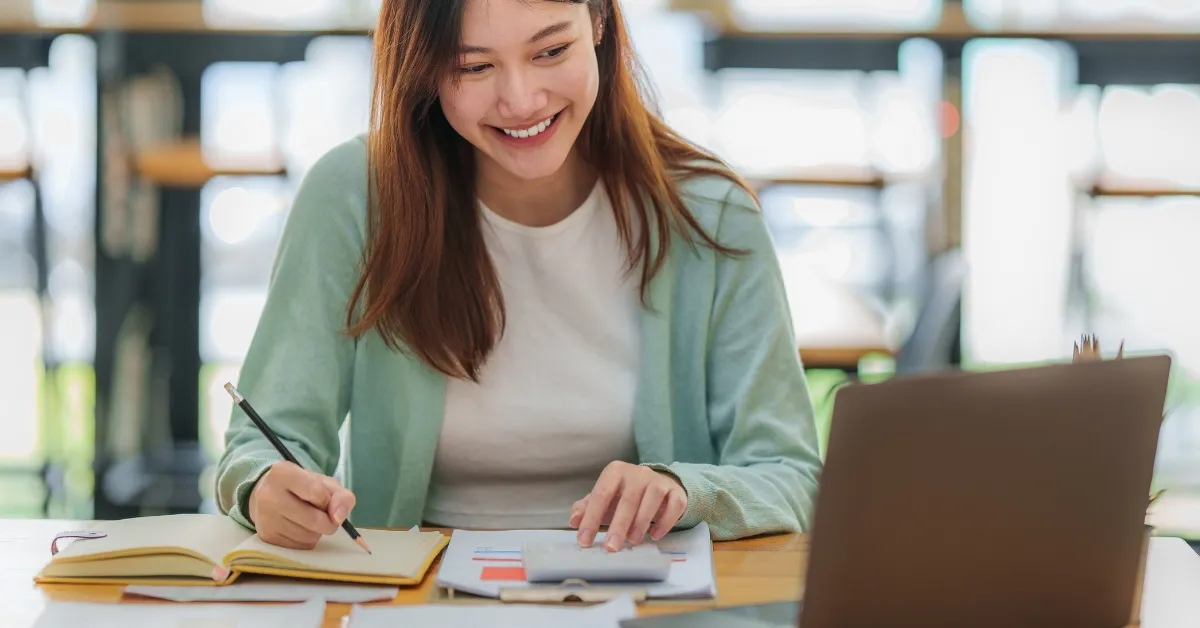 a woman with a laptop taking an elearning class