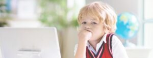 kid at a laptop accommodating learning at home