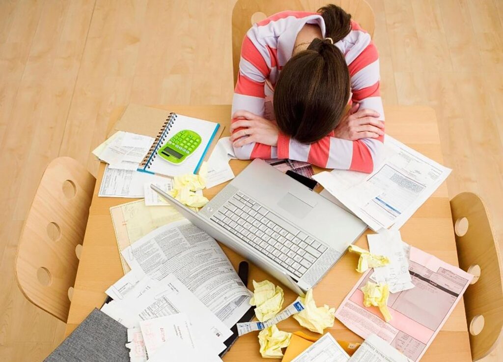 stressed parent at a desk